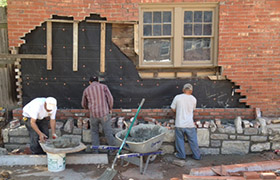 Brick facade and stone wal